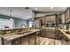 Kitchen featuring granite countertops, stainless steel appliances, and wood-look flooring at 316 Bennett St, Auburndale, FL 33823