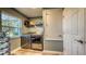 Functional laundry room with new washer and dryer and storage at 316 Bennett St, Auburndale, FL 33823