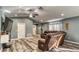 Cozy living room with stylish floors, comfortable recliners, and a relaxed atmosphere at 316 Bennett St, Auburndale, FL 33823