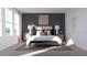 A cozy bedroom features a modern accent wall, stylish lamps, and a plush bed for ultimate relaxation at 326 Puma Loop, Groveland, FL 34736