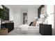 The serene bedroom features a plush bed, stylish nightstands, and elegant decor accents at 326 Puma Loop, Groveland, FL 34736