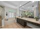 Bright bathroom with large mirror, soaking tub, and abundant cabinet space at 3267 Regal Crest Dr, Longwood, FL 32779