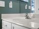 Close up of a clean white bathroom vanity with modern fixtures in a well lit room at 3267 Regal Crest Dr, Longwood, FL 32779