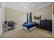 Cozy bedroom with neutral walls, a white bed frame, and a ceiling fan at 3267 Regal Crest Dr, Longwood, FL 32779