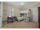 Bright bedroom with bunk beds and a desk under the window with shelves at 3267 Regal Crest Dr, Longwood, FL 32779