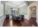 Elegant dining room with a large table, chandelier, and wainscoting at 3267 Regal Crest Dr, Longwood, FL 32779