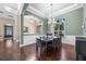 Dining room area with a modern chandelier and seamless transition to other living spaces at 3267 Regal Crest Dr, Longwood, FL 32779