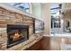 Close up of Stone Fireplace with open doorway to outdoor space at 3267 Regal Crest Dr, Longwood, FL 32779