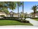 Charming home with lush landscaping, mature trees, and a well-maintained lawn creating inviting curb appeal at 3267 Regal Crest Dr, Longwood, FL 32779