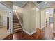 Open hallway showcases hardwood flooring, staircase, and neutral paint at 3267 Regal Crest Dr, Longwood, FL 32779