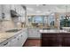 Gourmet kitchen featuring white cabinets, granite countertops, and stainless steel appliances at 3267 Regal Crest Dr, Longwood, FL 32779