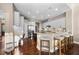 Spacious kitchen boasts white cabinets, granite counters, and stainless steel appliances at 3267 Regal Crest Dr, Longwood, FL 32779