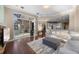Living room with hardwood floors, fireplace and access to outdoor patio and kitchen at 3267 Regal Crest Dr, Longwood, FL 32779