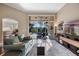 Bright living room features a modern design, light gray rug, and open access to outdoor patio at 3267 Regal Crest Dr, Longwood, FL 32779