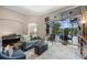Sunlit living room with comfortable seating and view of the pool and outdoor living area at 3267 Regal Crest Dr, Longwood, FL 32779