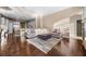 Spacious living room with hardwood floors, open to the kitchen, with a comfortable sectional sofa at 3267 Regal Crest Dr, Longwood, FL 32779