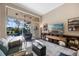 Bright living room with media center, large slider to outdoor patio/pool and contemporary design at 3267 Regal Crest Dr, Longwood, FL 32779