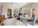 Open living space with hardwood flooring, plush seating, and seamless flow to adjacent rooms at 3267 Regal Crest Dr, Longwood, FL 32779