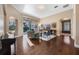 Bright living area with hardwood floors, comfortable seating, and view of outdoor pool at 3267 Regal Crest Dr, Longwood, FL 32779