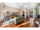 Open living area with hardwood floors, tray ceiling, and large window to the entryway at 3267 Regal Crest Dr, Longwood, FL 32779