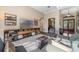 Open living room features media center, lots of natural light and access to front entryway at 3267 Regal Crest Dr, Longwood, FL 32779