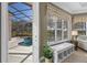 Gorgeous in-ground pool area with screened-in lanai and covered seating area at 3267 Regal Crest Dr, Longwood, FL 32779