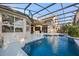 Rear exterior showing a private pool and patio framed by a screened enclosure and the home at 3267 Regal Crest Dr, Longwood, FL 32779