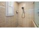 Close up of the walk-in shower with a shower head and shampoo nook at 3267 Regal Crest Dr, Longwood, FL 32779