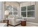 Bright sitting area with bench seating, large windows, and stylish window treatments at 3267 Regal Crest Dr, Longwood, FL 32779