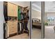 Custom walk-in closet with built-in shelving, drawers, and wardrobe racks at 3267 Regal Crest Dr, Longwood, FL 32779