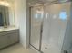 Modern bathroom with glass enclosed shower at 335 Ridgemark Ave, Groveland, FL 34736