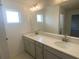 Bathroom featuring double sink vanity with quartz countertop at 335 Ridgemark Ave, Groveland, FL 34736