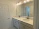 Bathroom featuring double sink vanity with quartz countertop at 335 Ridgemark Ave, Groveland, FL 34736