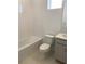 Bright bathroom with a tub and a window at 335 Ridgemark Ave, Groveland, FL 34736