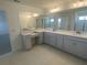 This bathroom features a double sink and vanity at 335 Ridgemark Ave, Groveland, FL 34736