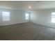 This bedroom is spacious and carpeted, and the natural light is abundant at 335 Ridgemark Ave, Groveland, FL 34736