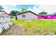 Outside view of fenced backyard with expansive yard space and neighboring homes at 3362 Janet St, Apopka, FL 32712