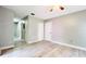 Bedroom featuring wood-look tile flooring, light gray walls, and a ceiling fan with light at 3362 Janet St, Apopka, FL 32712