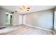 Bedroom featuring wood-look tile flooring, light gray walls, and a ceiling fan with light at 3362 Janet St, Apopka, FL 32712