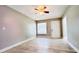 Bedroom featuring wood-look tile flooring, light gray walls, and a window at 3362 Janet St, Apopka, FL 32712