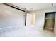 Attached garage with closet space, white marble-look tiled floor, and open door to house at 3362 Janet St, Apopka, FL 32712