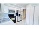 Modern kitchen with white cabinets, stainless steel appliances, and marble-look countertop at 3362 Janet St, Apopka, FL 32712