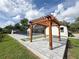 Backyard with paver patio, pergola, and inground pool surrounded by a safety fence at 3417 Bay Meadow Ct, Windermere, FL 34786