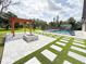 Beautiful backyard featuring a pool, pergola, outdoor fire pit, and lush landscaping at 3417 Bay Meadow Ct, Windermere, FL 34786