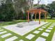 Backyard with pergola, pavers and fire pit, perfect for outdoor relaxation and entertainment at 3417 Bay Meadow Ct, Windermere, FL 34786