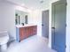 Bathroom featuring a modern vanity and sink, grey trim, and tile floors at 3417 Bay Meadow Ct, Windermere, FL 34786