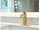 Close up on a modern golden waterfall faucet in the primary bathroom at 3417 Bay Meadow Ct, Windermere, FL 34786