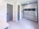 Bathroom featuring a frameless glass shower, tile floors, and grey trim at 3417 Bay Meadow Ct, Windermere, FL 34786