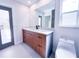 Contemporary bathroom featuring a wood vanity, quartz counters, and updated fixtures at 3417 Bay Meadow Ct, Windermere, FL 34786