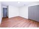 A bright bedroom with hardwood floors, white walls and trim, and a closet at 3417 Bay Meadow Ct, Windermere, FL 34786